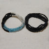 Two strands of colorful belly bead chains, featuring black and iridescent blue beads.