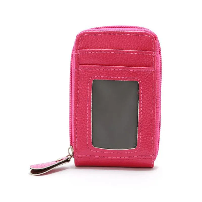 A pink genuine leather multi-slot wallet for cards and cash shown from the front.