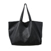 A black oversized PU leather tote bag with a handle is shown against a white background.