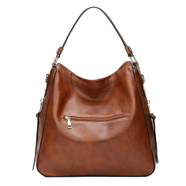 A brown vintage faux leather hobo shoulder bag with a long strap and flap closure.