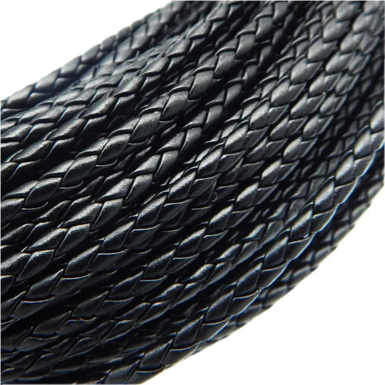 Close-up view of black braided leather cord used for jewelry making
