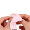Hands holding a pink polishing cloth set for silver and gold jewelry