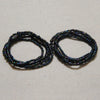 A pair of dark blue and black belly bead chains for body jewelry