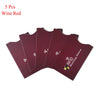 Five red wine colored RFID blocking card sleeves laid out flat.