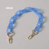 A light blue adjustable detachable chain shoulder bag with a 42cm length.
