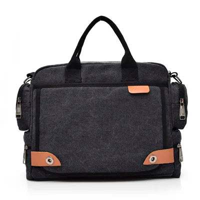 A dark gray canvas crossbody messenger bag with black straps and tan accents.
