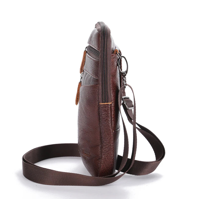 A brown genuine leather crossbody phone pouch with a strap shown against a white background.