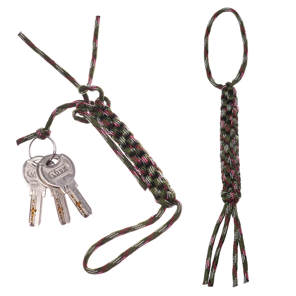 A green and pink 7-strand paracord keychain with a metal lock and utility rope.