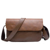 A brown retro PU leather crossbody shoulder bag with a strap shown against a white background.