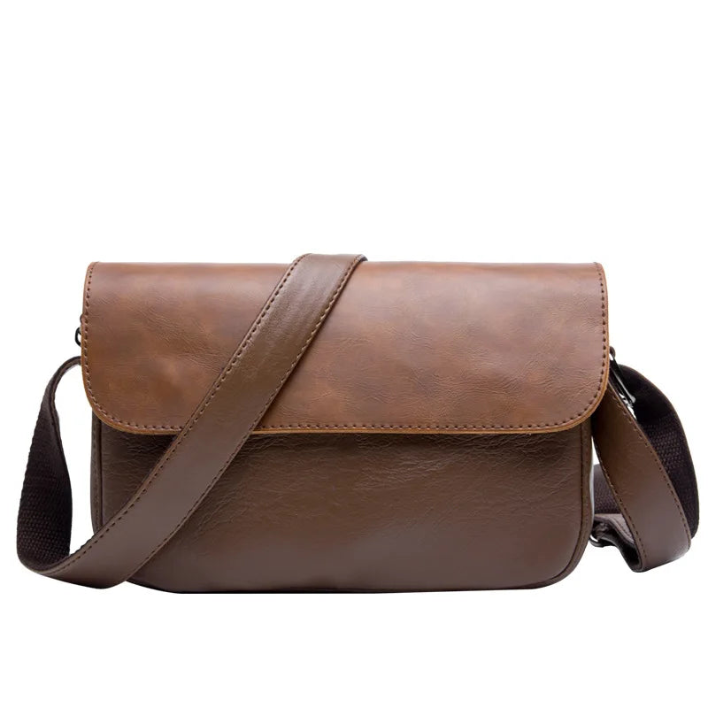 A brown retro PU leather crossbody shoulder bag with a strap shown against a white background.