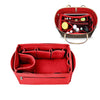 A red collapsible felt cosmetic organizer pouch with a handle and an interior compartment.
