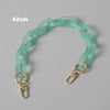 A light mint green adjustable detachable chain shoulder bag with a 42cm length.