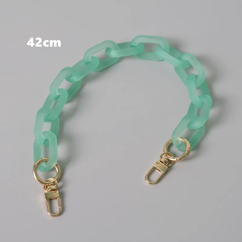 A light mint green adjustable detachable chain shoulder bag with a 42cm length.