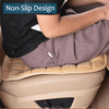 A close-up of a plush car seat cover in brown fabric being placed onto a beige car seat cushion.