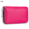 A vibrant pink genuine leather accordion card holder wallet with a zippered closure.