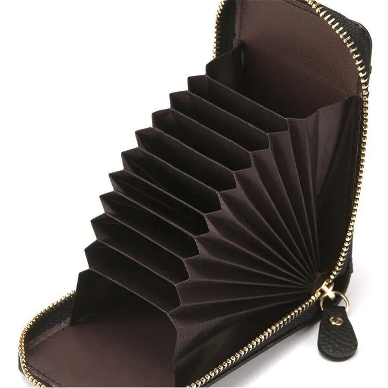A dark brown genuine leather multi-slot wallet with a zippered closure and pleated design.