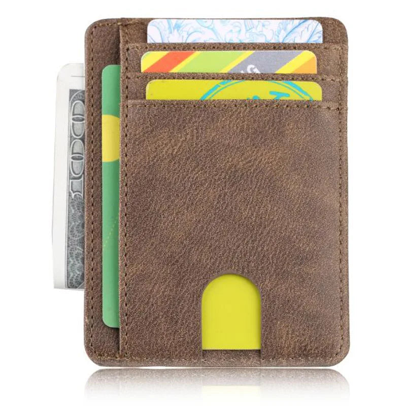 A brown leather wallet with a slot for cards and a yellow cutout, showing various cards inside.