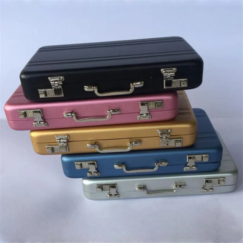 A stack of five premium aluminum credit card and ID holder cases in black, pink, gold, blue, and silver.