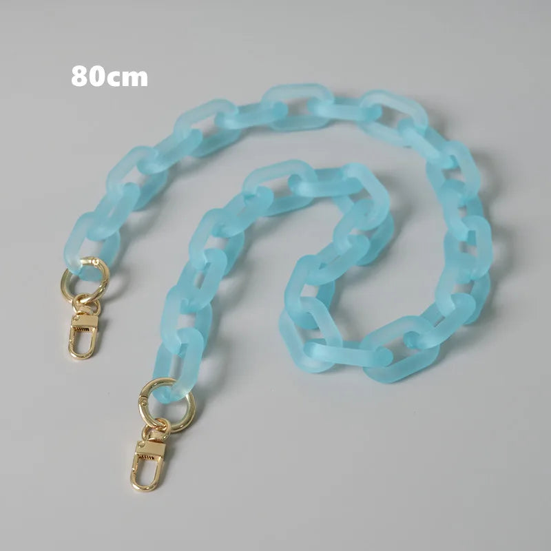 Light blue adjustable detachable chain shoulder bag displayed on a gray background.