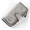 A light gray elegant PU leather card holder wallet with a stitched detail and gold-toned zipper.
