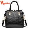 Black crocodile-embossed leather tassel shoulder bag with gold hardware