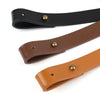 A close-up view of an adjustable PU leather crossbody strap in dark brown and black colors.