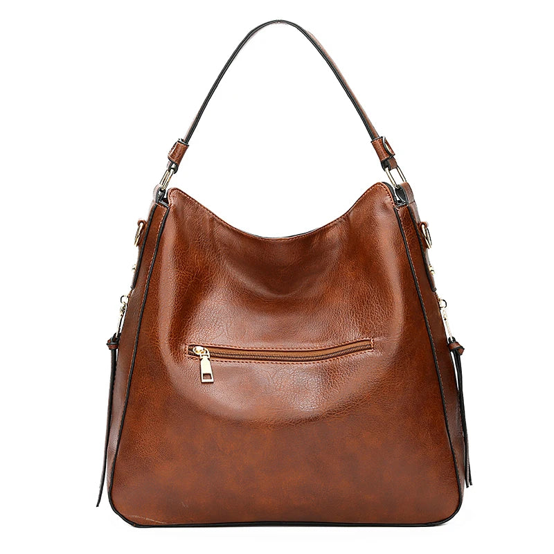 A brown vintage faux leather hobo shoulder bag with a long strap and flap closure.