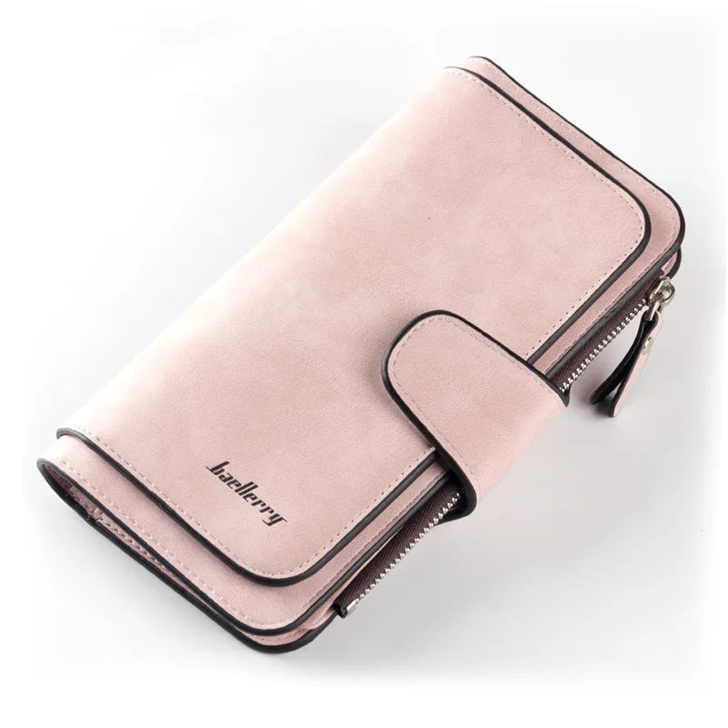 A pale pink elegant PU leather card holder wallet with a zippered closure and stitched detailing.
