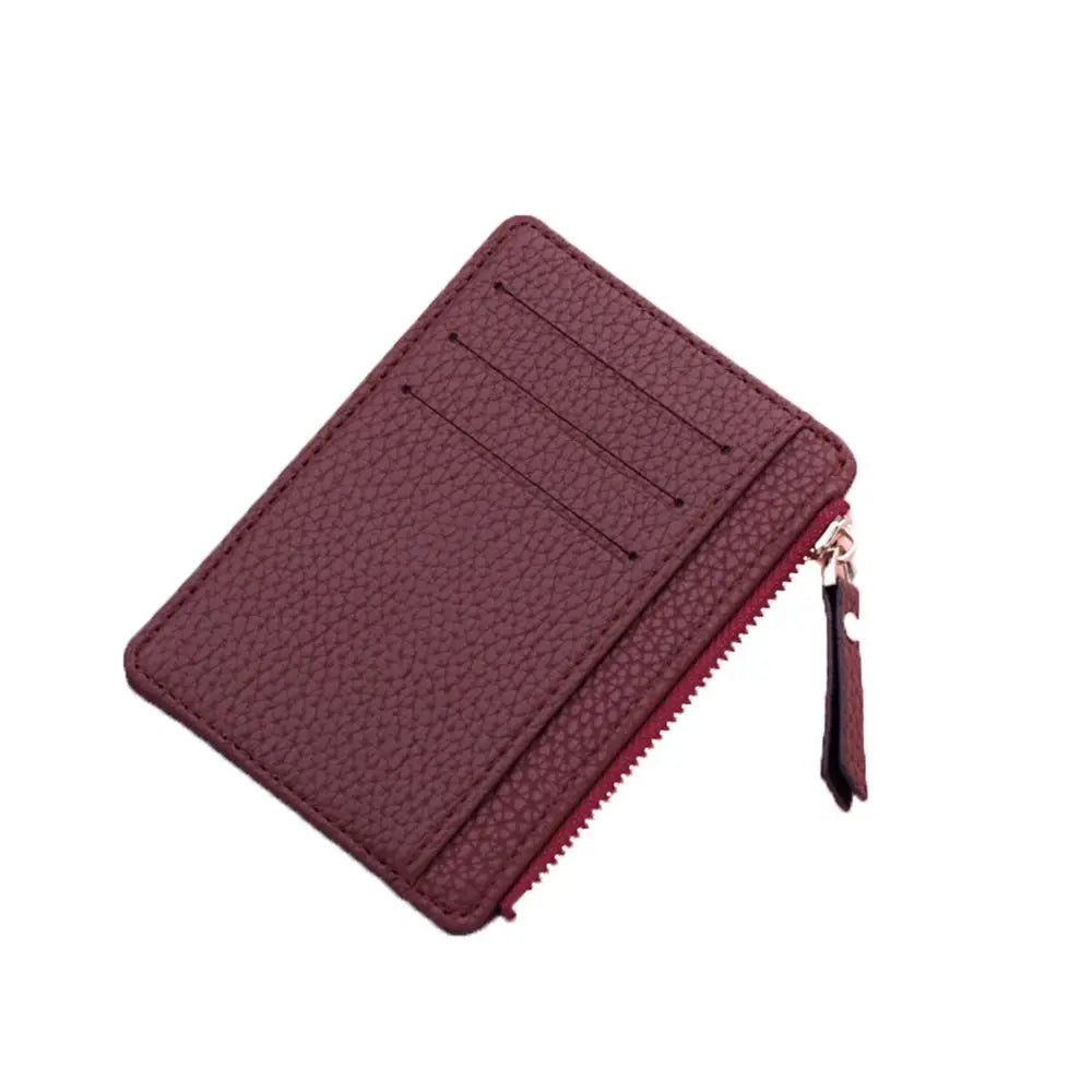 A maroon PU leather card holder wallet with a stitched edge and keychain detail.