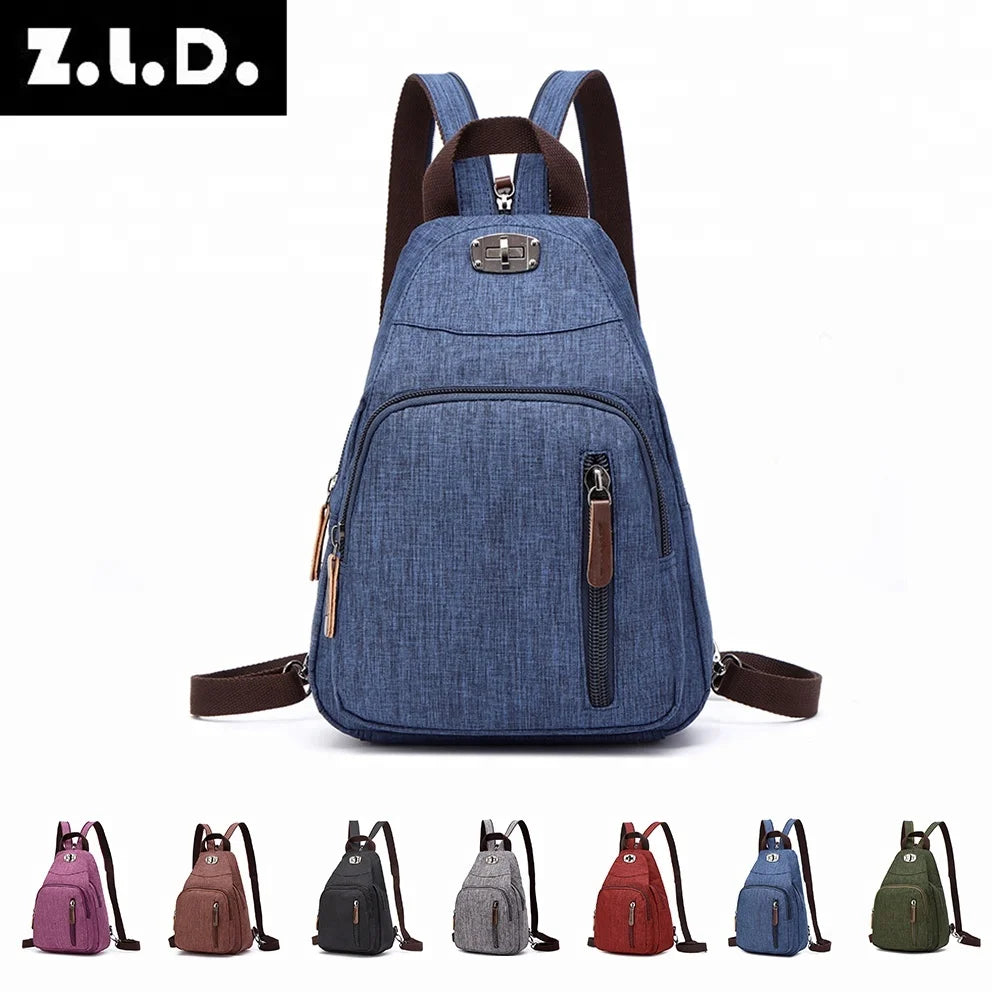 A collection of fashion designer canvas backpacks in various colors including blue, brown, and green.