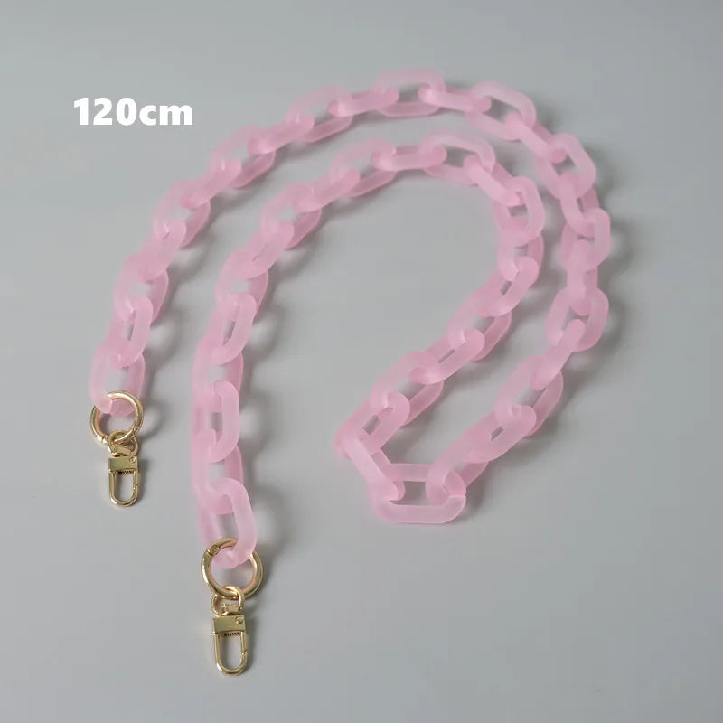 A pink adjustable detachable chain shoulder bag is displayed on a gray background.