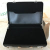 Black aluminum credit card and ID holder case with a leather interior lining