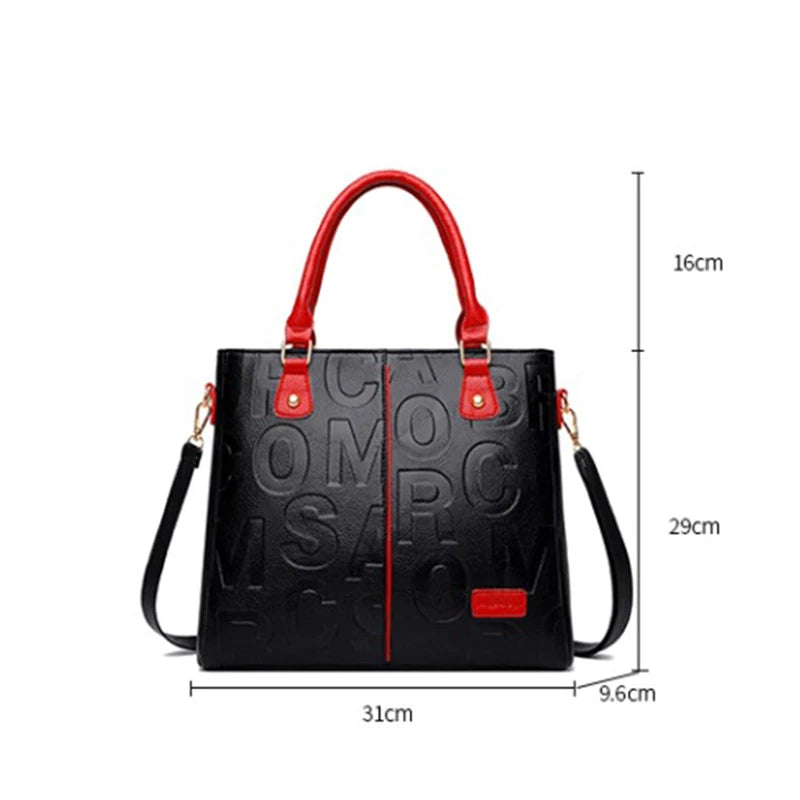 Sac à main en cuir PU noir avec poignées rouges et accents dorés, vue de face.