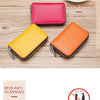 Two genuine leather accordion card holder wallets in pink and orange colors displayed on a wooden surface.