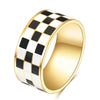 A gold ring with a black and white checkerboard pattern.