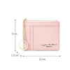A pink compact PU leather zip wallet with a gold chain keychain shown from the side.