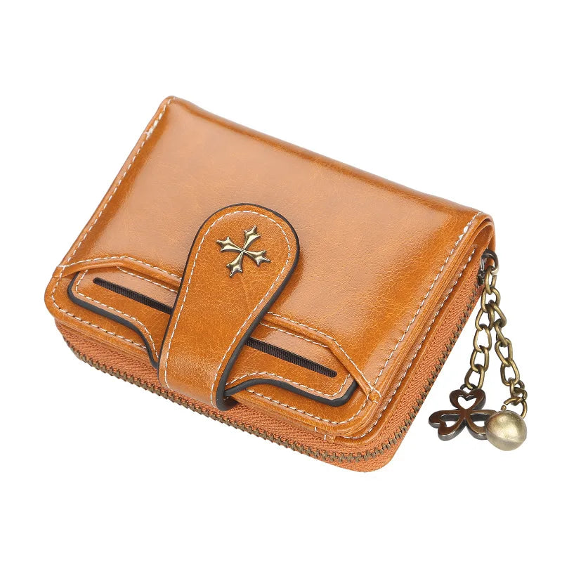 A brown PU leather compact wallet featuring a zipper closure and a gold-toned chain.