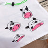 Sac de shopping cartonné et écologique blanc pliable avec des illustrations de vaches roses et noires.