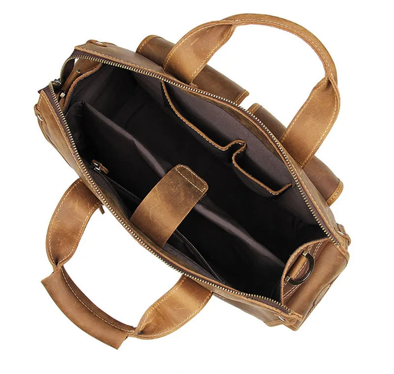 A brown genuine cowhide leather briefcase with tan leather straps and a zippered interior.