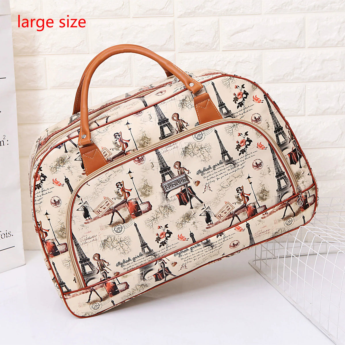 A large beige and brown patterned PU leather travel duffel bag featuring Eiffel Tower illustrations.