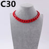 A red acrylic link chain necklace displayed on a mannequin neck.