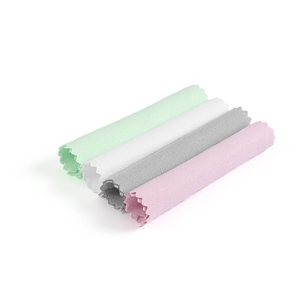 A set of three polishing cloths in pastel shades of mint green, gray, and pink.