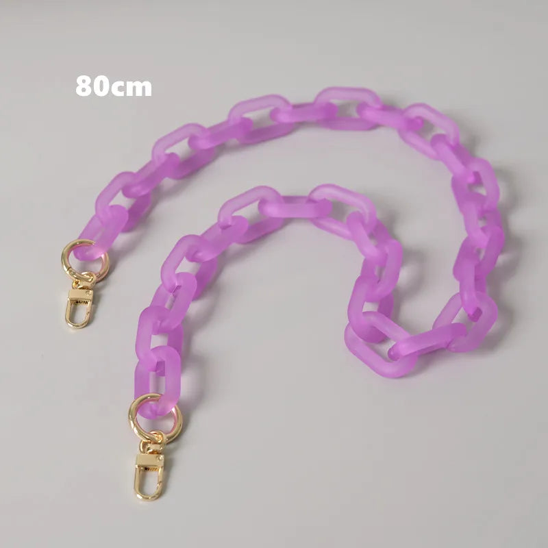 A purple adjustable detachable chain shoulder bag with gold-colored clasps.
