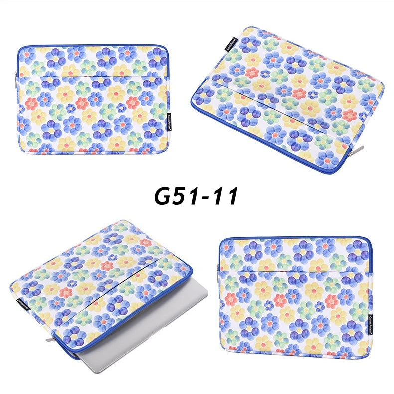 A colorful floral patterned laptop sleeve in blue and white for a MacBook Pro.