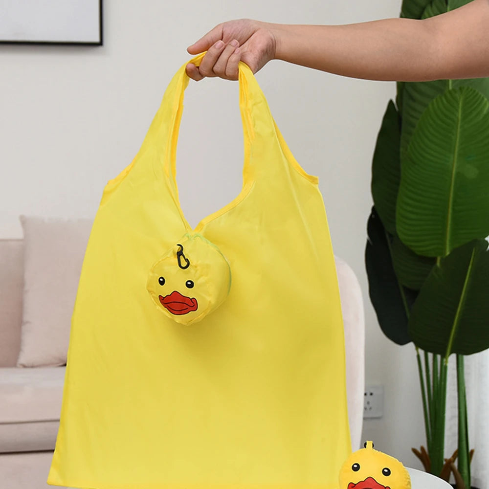 Sac de shopping jaune, pliable et écologique, avec un visage de canard.