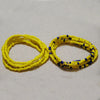 Yellow and blue bead chains for body jewelry displayed on a white background.