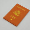 Orange leather passport holder with gold embossed United States of America eagle design