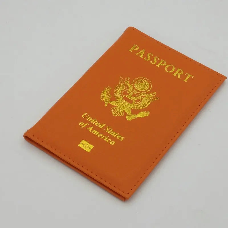 Orange leather passport holder with gold embossed United States of America eagle design