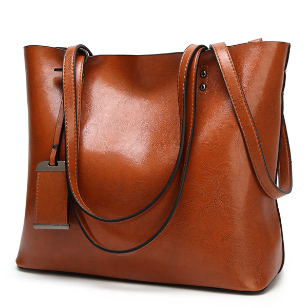 A brown waxed leather bucket bag with dual straps shown from the side.