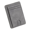 A slim gray leather card holder wallet with multiple slots and a cutout for a card.